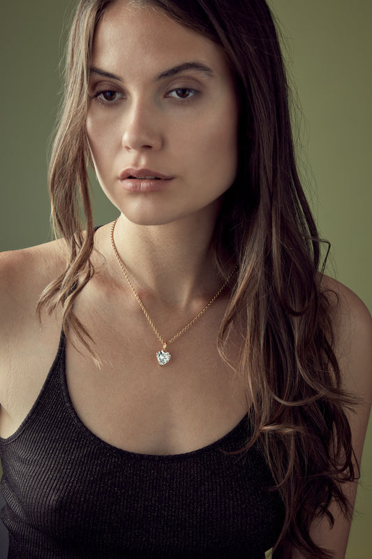Model with gold & Crystal Heart Pendant