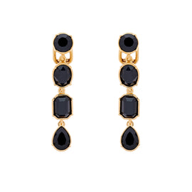 A pair of clip-on earrings featuring multiple cut jet crystals set in gold plating.