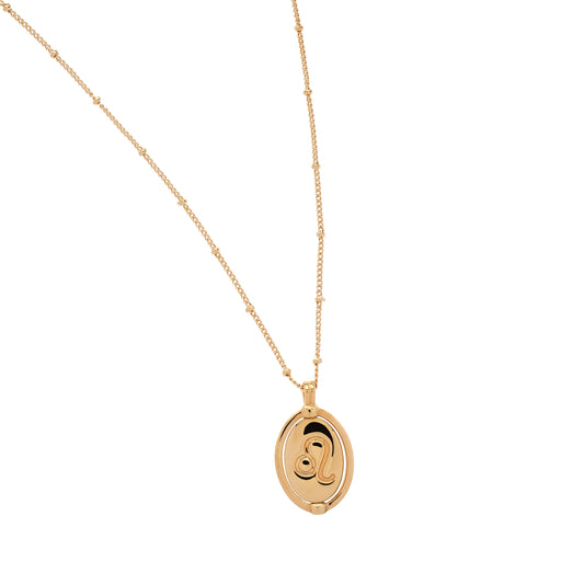 Gold necklace with a pendant on a white background