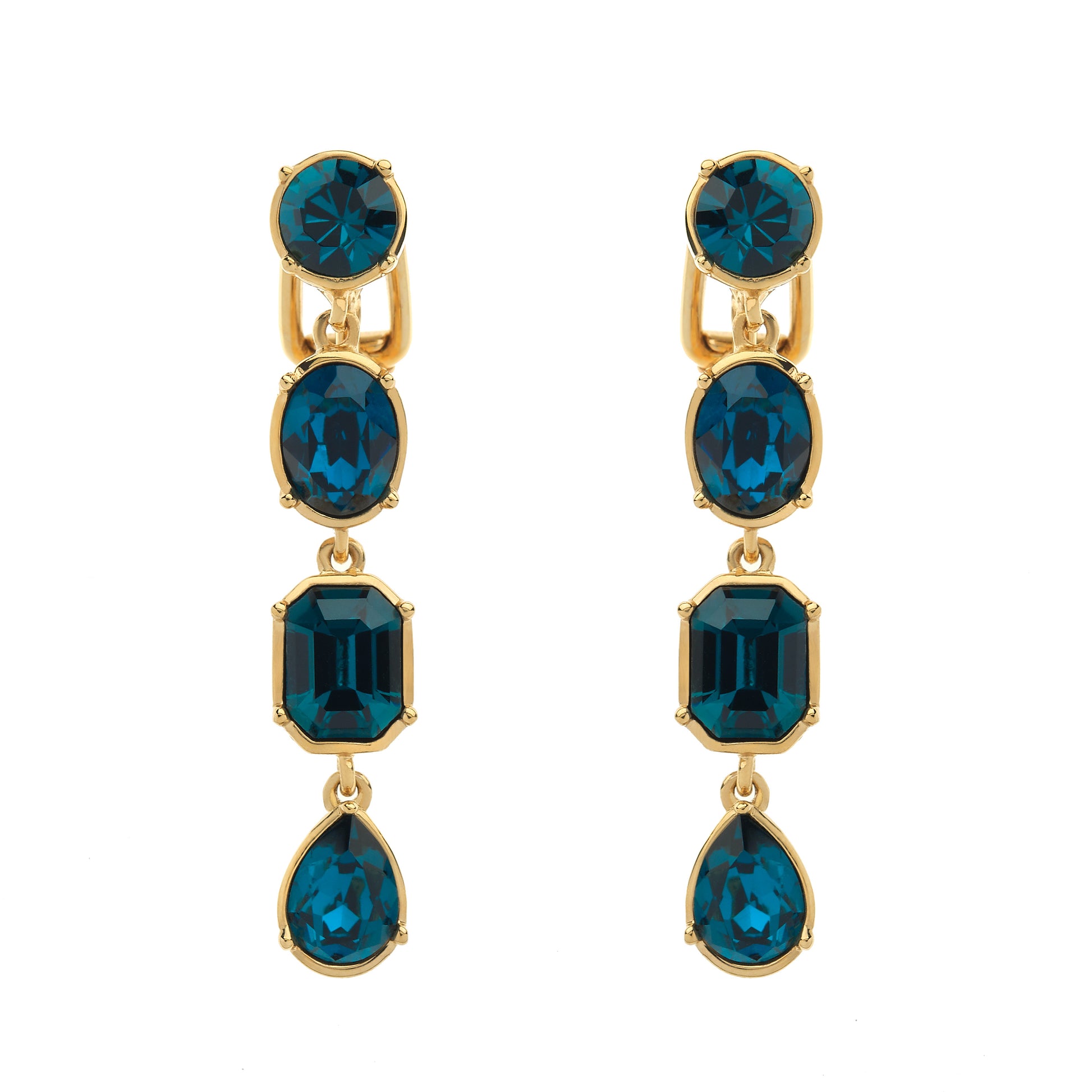 Gold earrings with blue gemstones on a white background