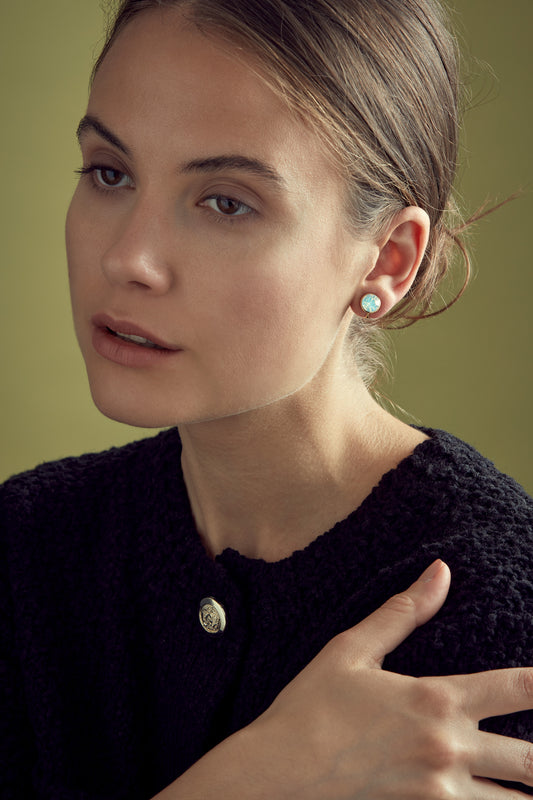 A model wearing Opal crystal clip on earrings