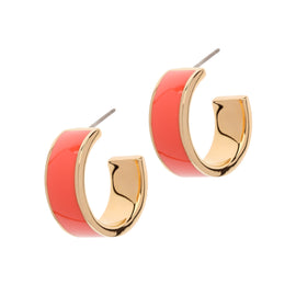 Pair of hoop earrings with gold and red enamel on a white background