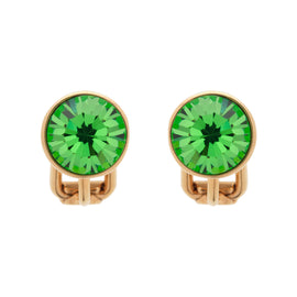 Pair of gold crystal earrings with green gemstones on a white background
