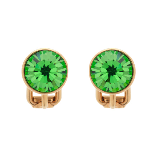 Pair of gold crystal earrings with green gemstones on a white background