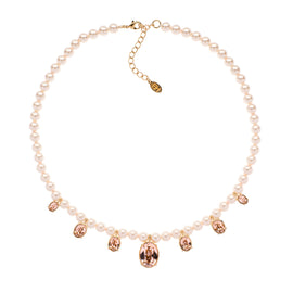 Pearl necklace with rose gold crystal charms on a white background