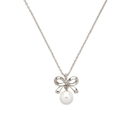 Silver necklace with a bow and pearl pendant on a white background