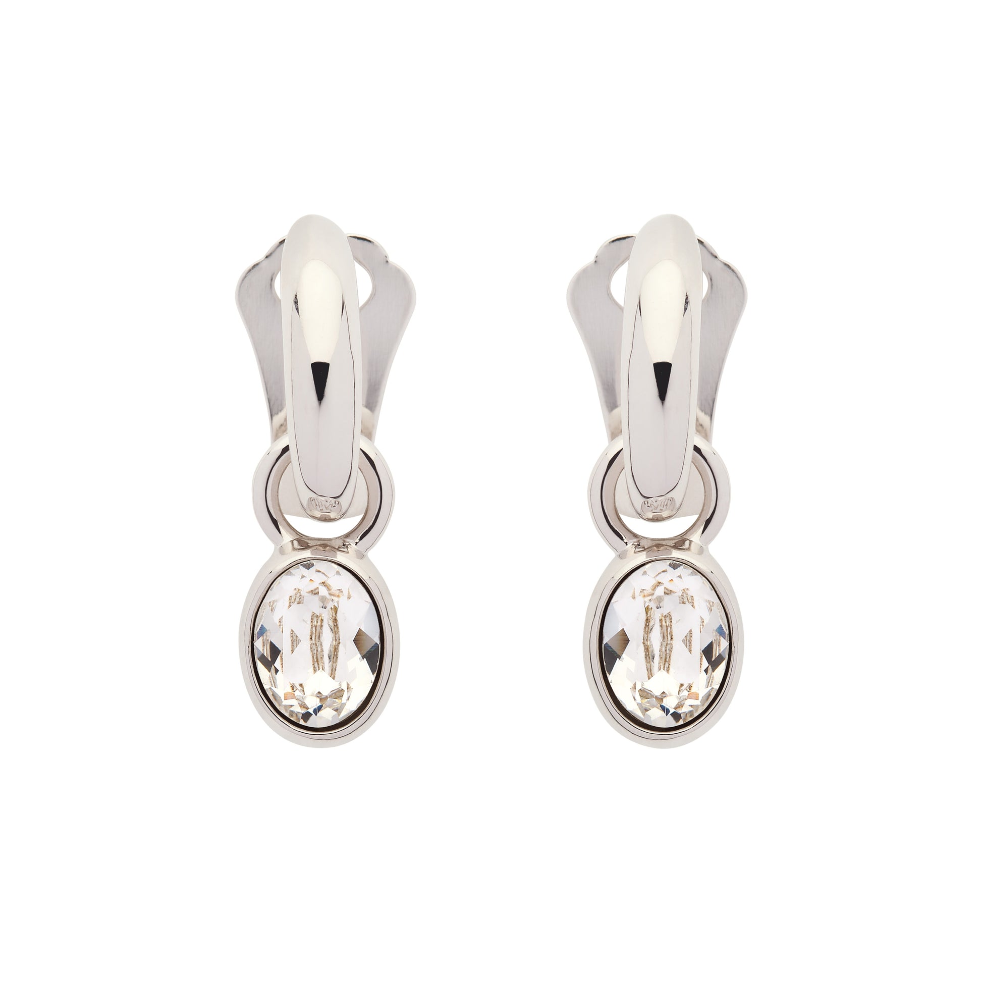 Pair of silver earrings with clear gemstones on a white background