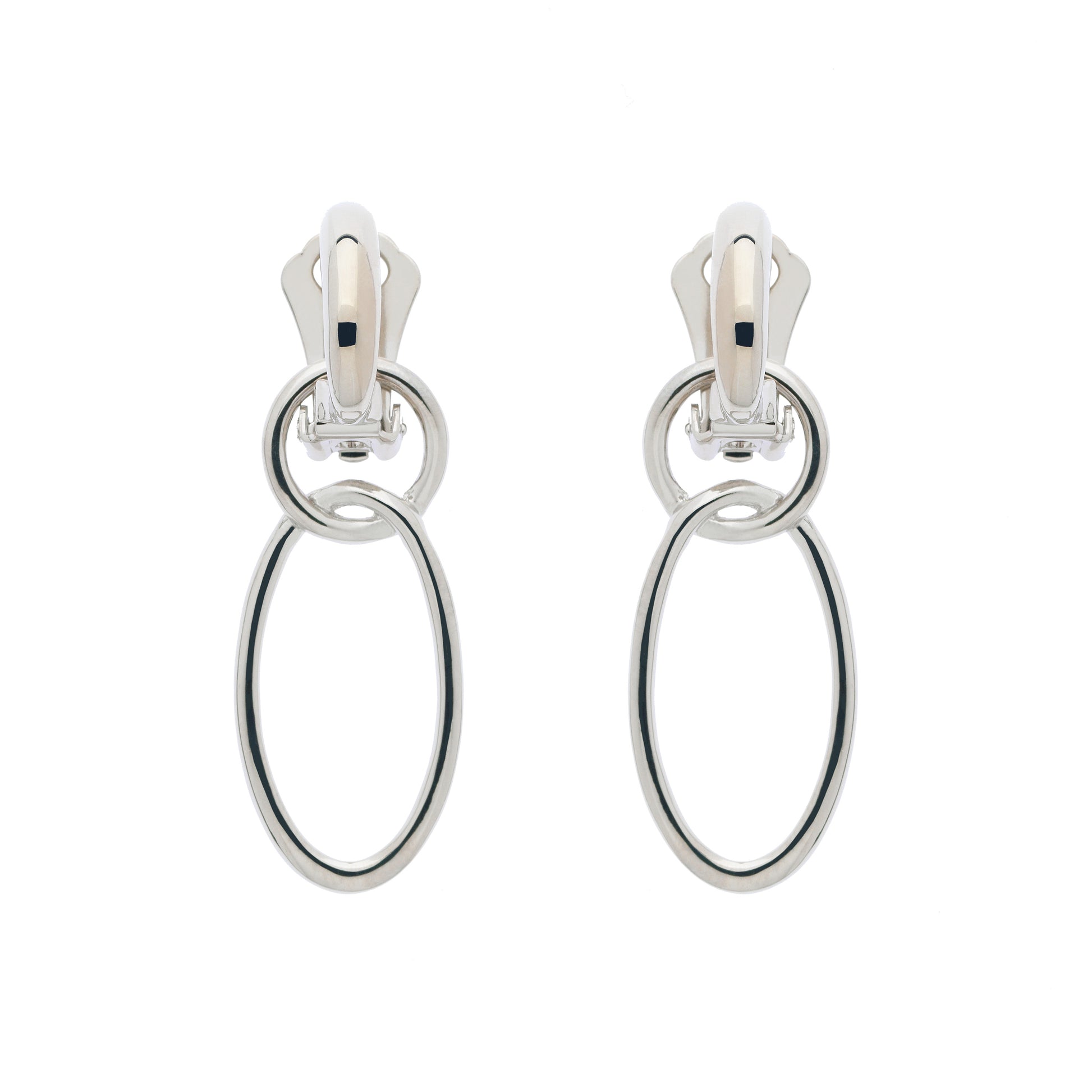 A pair of clip-on earrings featuring two concentric platinum hoops.