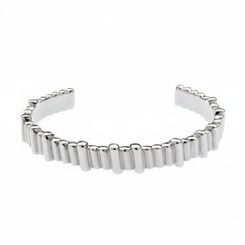 A polished silver cuff bracelet featuring a textured, segmented outer edge, displayed on a clean white background.