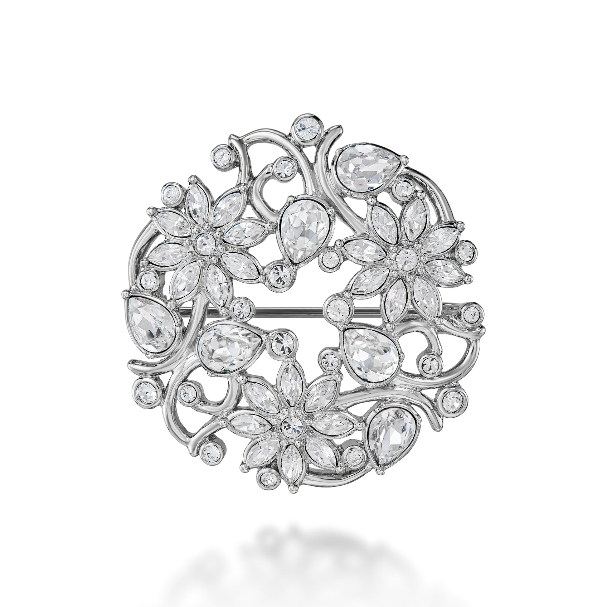 Silver brooch with floral design and clear stones on a white background