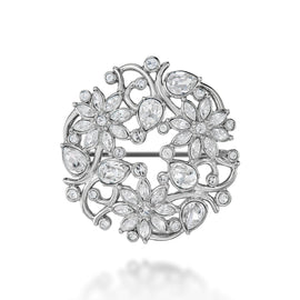 Silver brooch with floral design and clear stones on a white background