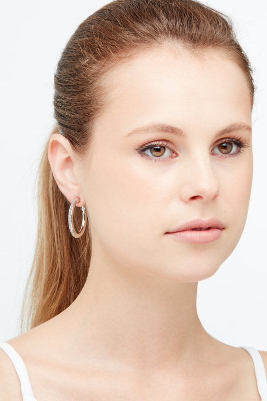 A model wearing Platinum and Crystal Hoop clip on earrings
