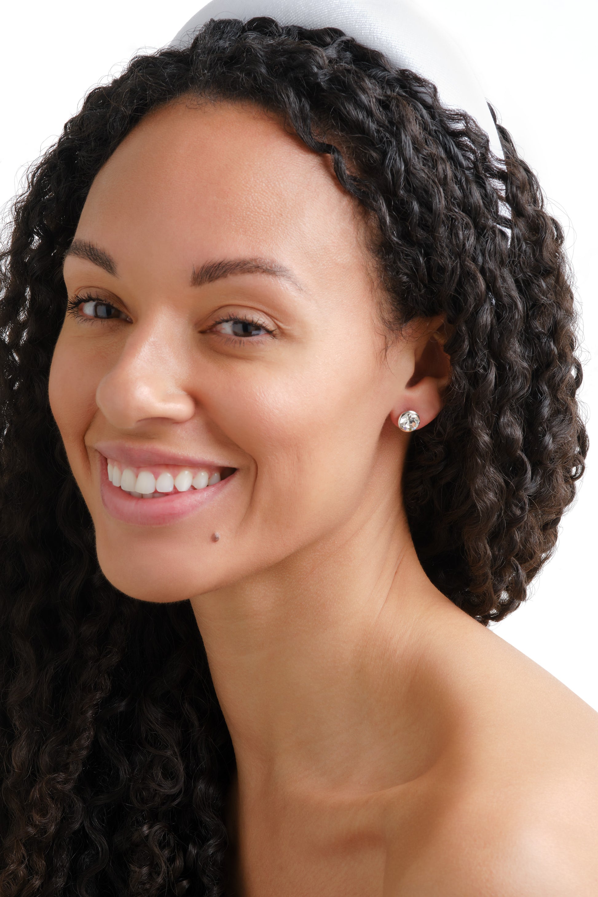 A model wearing Emma Holland crystal stud earrings