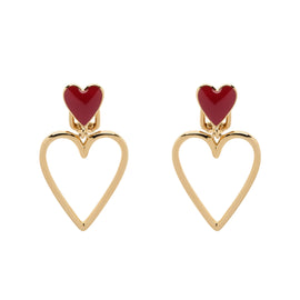 Heart-shaped earrings with red centers and gold frames on a white background
