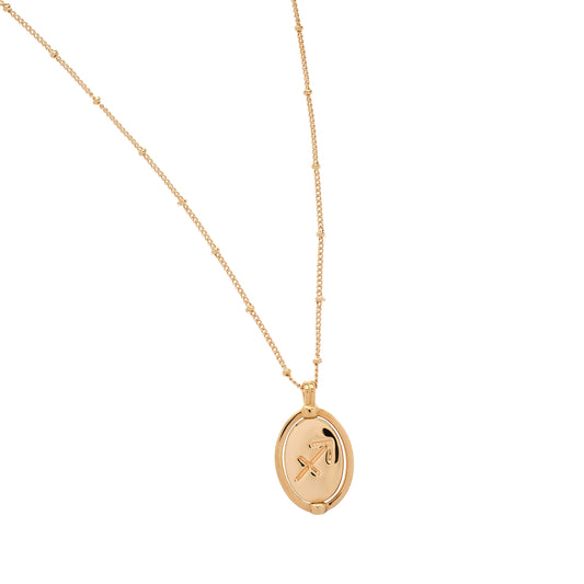 Gold necklace with a pendant on a white background