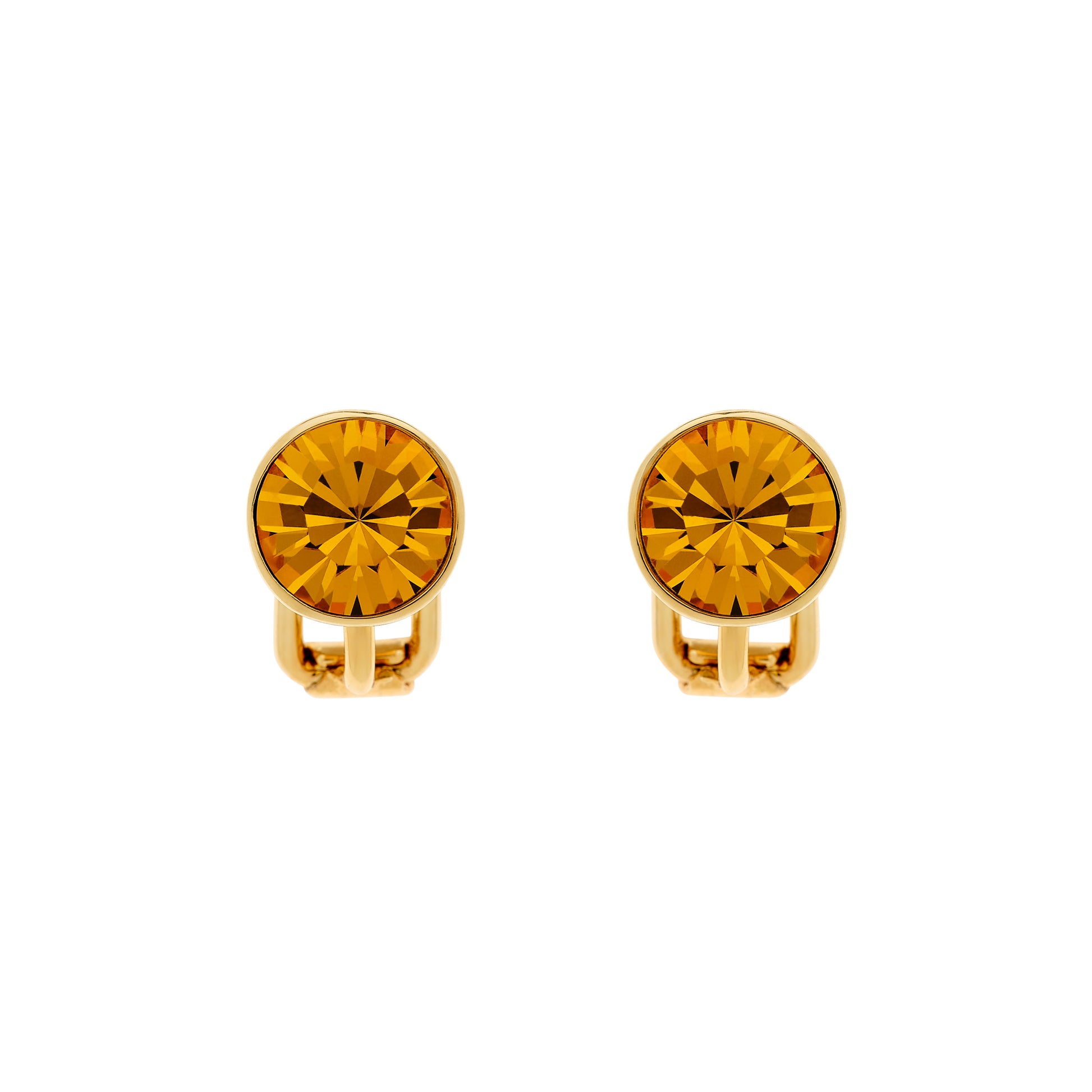 A pair of gold-colored stud clip earrings with topaz crystal embellishments.