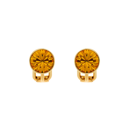A pair of gold-colored stud clip earrings with topaz crystal embellishments.